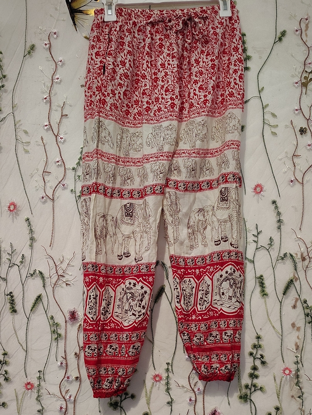These are bohemian-style Thai Elephant Harem Pants featuring a red,ivory& Multi